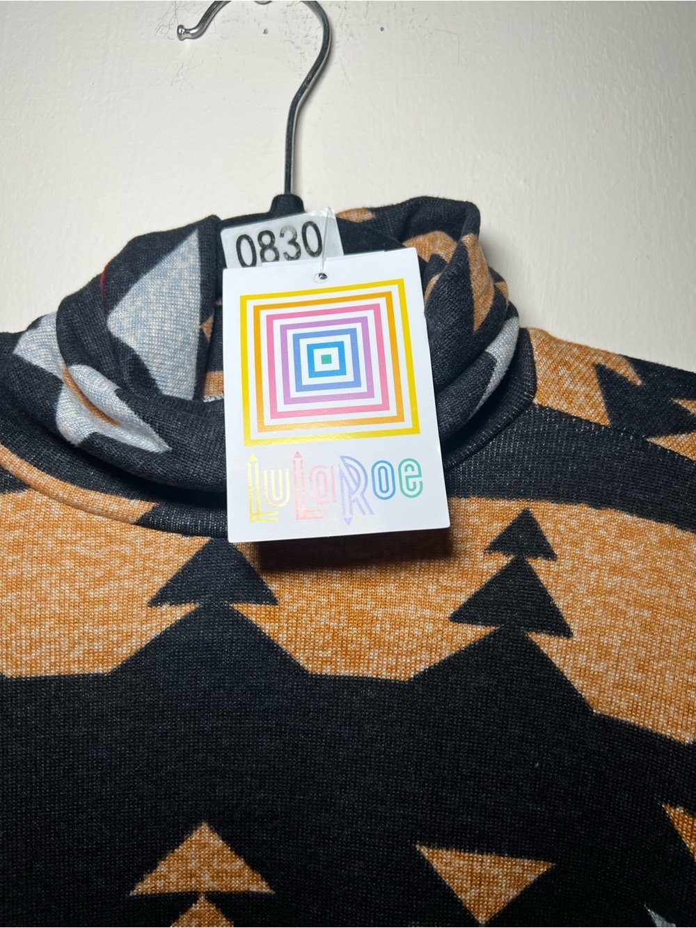 LuLaRoe Black Turtleneck Sweater with “Gold”, Red, and Silver Geometric Print - Picture 2 of 4